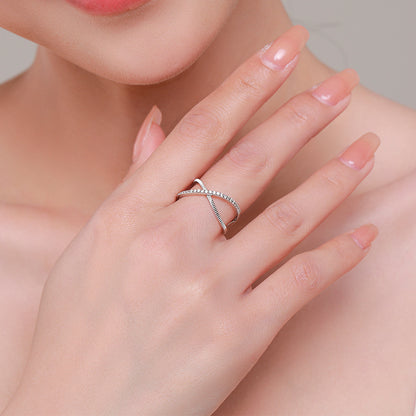 Crossed Sparkling Clear CZ Ring