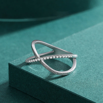 Crossed Sparkling Clear CZ Ring